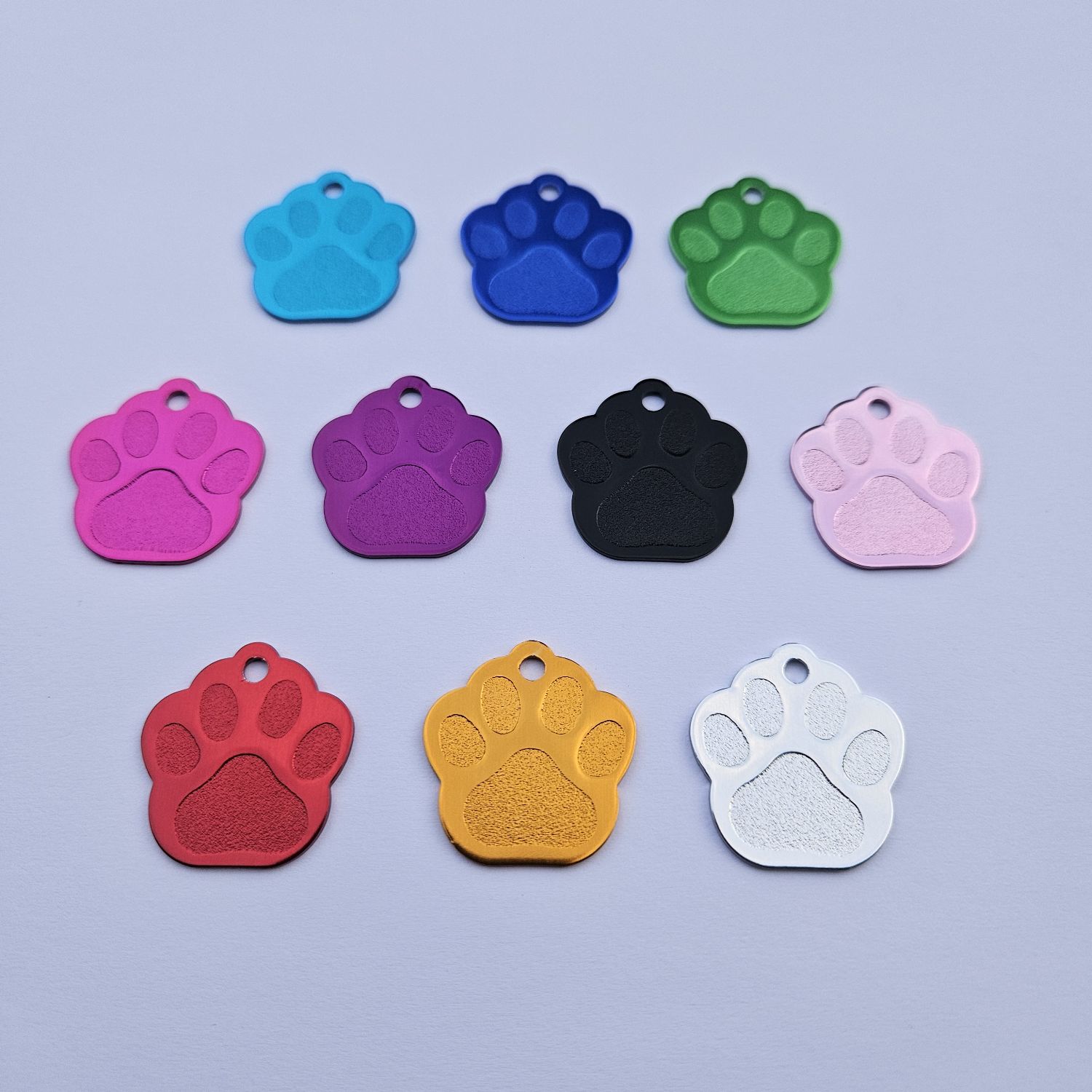 Schlüsselanhänger / Hundemarke in Pfotenform, inklusive Lasergravur und Schlüsselring Schlüsselanhänger / Hundemarke in Pfotenform, inklusive Lasergravur und Schlüsselring
